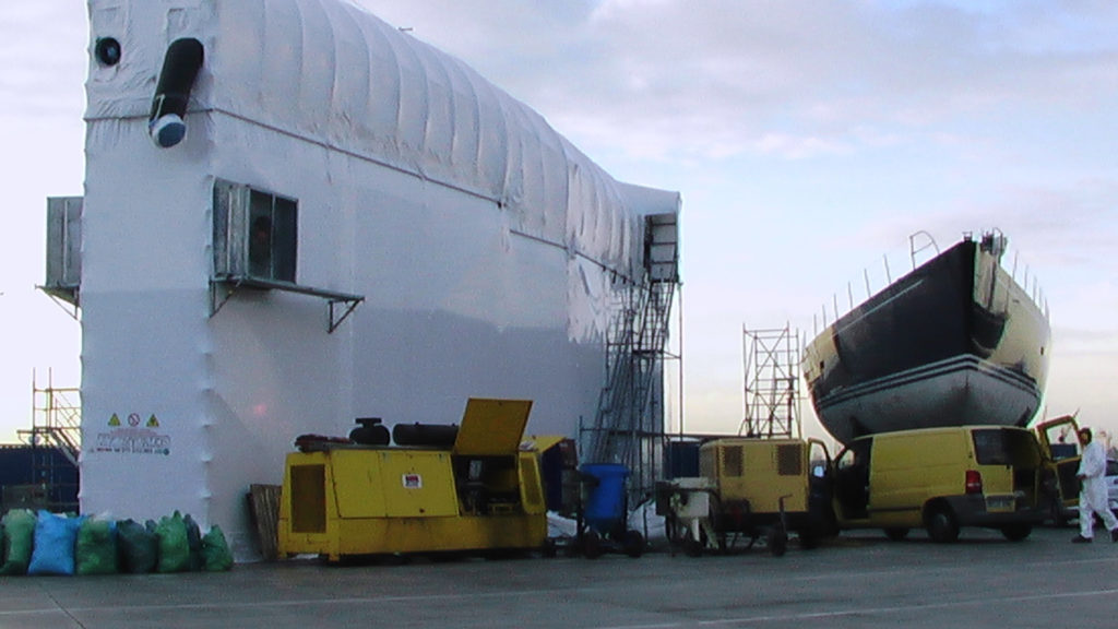 Encapsulated superyacht with UHP 55,000 psi and wet abrasive blast equipment on location Encapsulated superyacht with UHP 55,000 psi and wet abrasive blast equipment on location